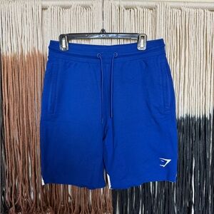 Blue Gymshark lightweight sweat shorts with zipper pockets; perfect condition